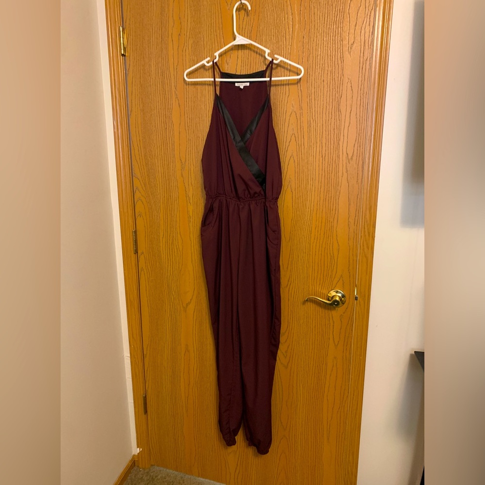 Maroon with black detail jumpsuit size small from charlotte ruse